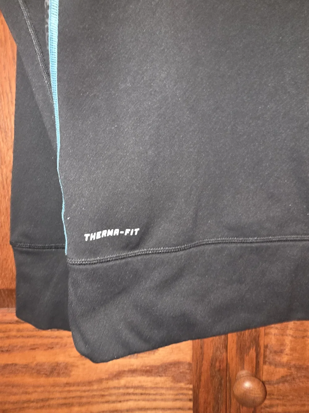 Nike Black Hoodie with Teal Accents and Striped Front